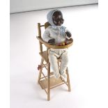 A BND black composition doll, with sleepy eyes, open mouth and teeth,