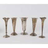 A pair of silver vases, Birmingham 1905, 16cm high and three other silver vases,