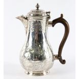 A Continental silver jug, of baluster shape with hinged cover to the spout, Lausanne circa 1740,