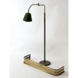 An adjustable reading lamp and a brass fire curb