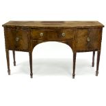 A 19th Century bowfront sideboard, on square tapering legs with spade feet,