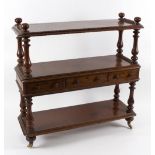 A late 19th Century mahogany three-tier buffet, fitted three drawers, on baluster supports,