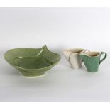 A leaf shaped green glazed dish and two similar stylised jugs,