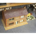 A hand built dolls house, 77cm wide,