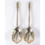 A pair of silver apostle spoons, Thomas Bradley & Sons, London 1898, with shell bowls,