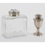 A cut glass scent bottle, the circular cut glass cover with white metal mounts, 11.