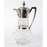 A Victorian silver mounted claret jug, Charles Boyton, London 1880, the hinged cover with finial,