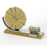 An Art Deco onyx desk clock with chromium sledge type support having perpetual calendar,