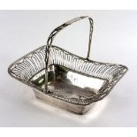 A Sheffield plated swing handle basket of oblong shape with pierced border,