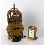 A reproduction lantern clock, the dial signed Tho' Moore, Ipswich, 36.