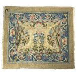 A William Morris rug of foliate design within a blue border, monogrammed to corner, 142cm x 125.