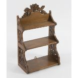 A set of carved wall shelves, the crest and sides with oak sprig decoration, 34.