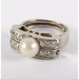 A cultured pearl and diamond dress ring, the central cultered pearl approximately 7.