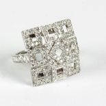 A Boucheron diamond set dress ring of modern design to an 18ct white gold mount,