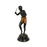 A spelter figure of a tribesman holding a dagger, 33.