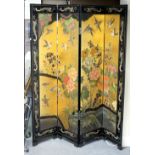 A Chinese four-fold screen, carved and painted plants and animals,