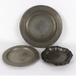 A pewter charger, 42cm diameter, a pewter plate,