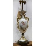 Continental scenic urn form table lamp, of urn form, having gilt handles flanking the scenic