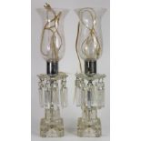 Pair of crystal lustre table lamps, having etched hurricane shades above floral form glass cups with