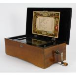 Columbia cylinder music box, playing 6 tunes, with tune indicator card, the ebonized case centered