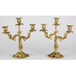 Pair of Neoclassical style gilt bronze candelabra, each having three lights, with scrolled arms,
