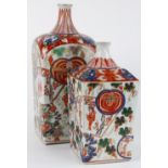 (lot of 2) Japanese Imari bottles, rectangular body decorated with flowers and dancers, rounded