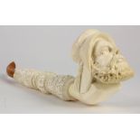 Meerschaum detachable stem pipe, early 20th century, with Arabesque floral accents, depicting a