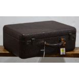 Leather vanity traveling case, opening to a nine piece vanity set including a comb, a mirror, a