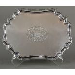 George III sterling silver salver, London, 1806, the shaped style centered with a hammered coat of