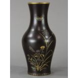 Japanese enameled iron vase, gilt rim above thick neck and ovoid body decorated with