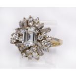 Diamond and 18k yellow gold ring centering (1) emerald-cut diamond, weighing approximately 1.30