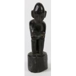 Ifugao, Philippines, small hunkered figurine with head bowed (Bulul), very narrow waist, glossy