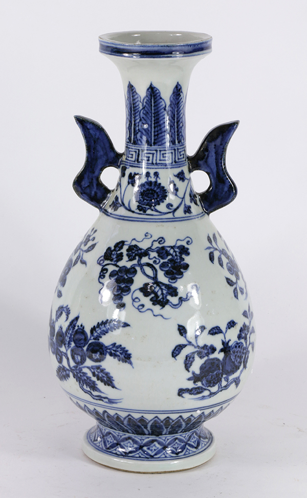 Chinese underglaze blue porcelain vase, of hu form with shaped handles flanking the neck detailed