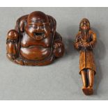 (lot of 2) Japanese wood netsuke: a happy Hotei with a jewel; together with a foreigner with a doll,