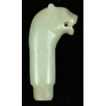 Carved hardstone handle, in the form of a lion head, executed from a celadon hue matrix, 4.125"h