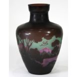 Galle style cameo glass vase, having a tapered form in violet cut to green, decorated with scenic