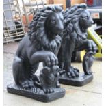 Pair of lion form garden elements, each having a black paint over concrete body, 28"h