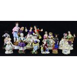 (lot of 11) Continental figural groups, each polychrome decorated, three with Crown N mark, also