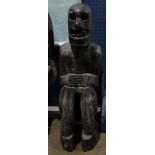 Burial figure with a lidded chamber carved into the back for magical purposes, dramatic head skull-