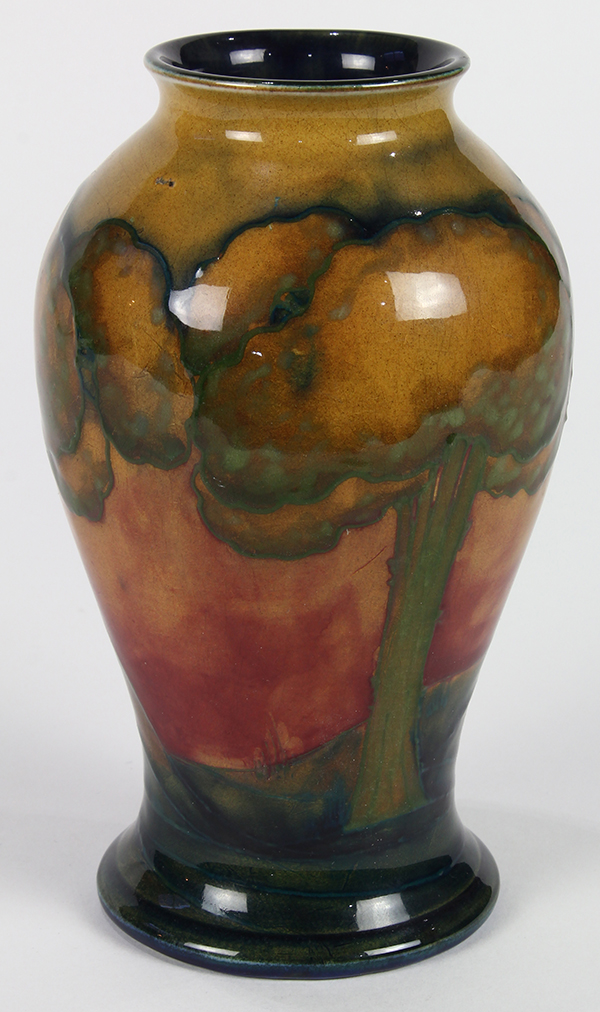 Moorcroft 'Eventide' vase, circa 1925, the baluster form depicting a landscape design with trees