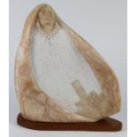 Zuni alabaster carved sculpture, depicting a stylized figure, draped in shawl, wearing a white robe,
