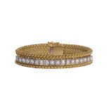 Diamond, platinum and 18k yellow gold bracelet featuring (18) full-cut diamonds, weighing a total of