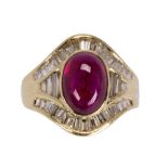Ruby cabochon, diamond and 18k yellow gold ring featuring (1) ruby cabochon, measuring approximately