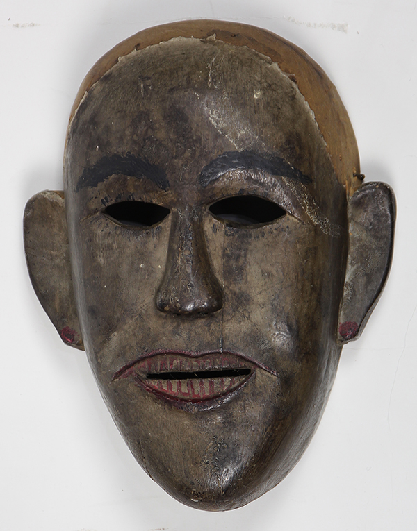Batak, Indonesia, carved wood mask with polychrome decoration, 10.5"h