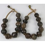 (lot of 2) Kuba style, D.R. Congo necklace, each with carved wood pendants and copper ring