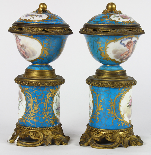 Pair of Sevres style cylindrical lidded urns, each having floral reserves and accented with gilt - Image 4 of 8