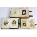 (Lot of 3) Victorian tintype photo albums, each with embossed leather covers, 6"h x 5.5"w x 2.5"d