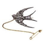 Victorian diamond and silver topped-14k yellow gold swallow brooch designed as a swallow,