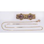 (Lot of 2) Amethyst and yellow gold jewelry including one brooch, featuring (2) oval-cut amethyst,