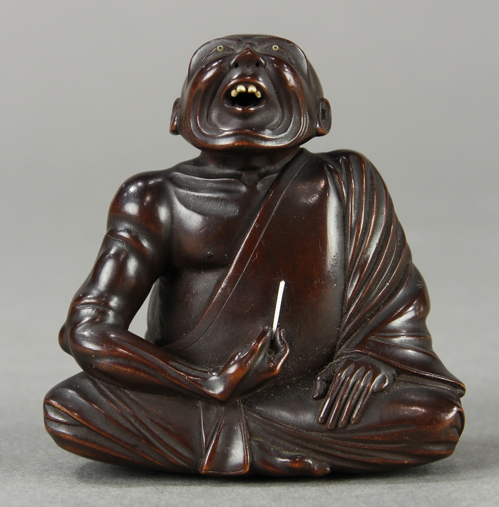 Japanese wood netsuke: featuring a 'Professional Sneezer', signed [Hidekazu], approx. 2.75"h